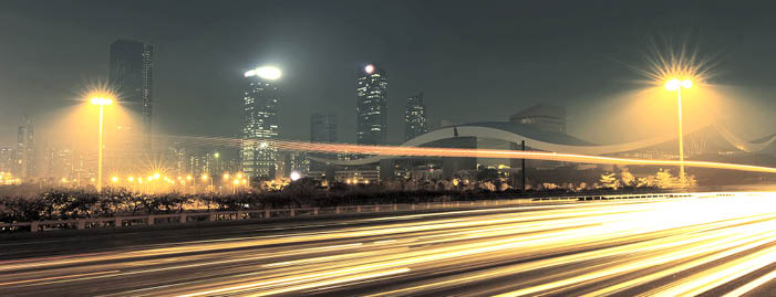 the light trails on the modern building background in city