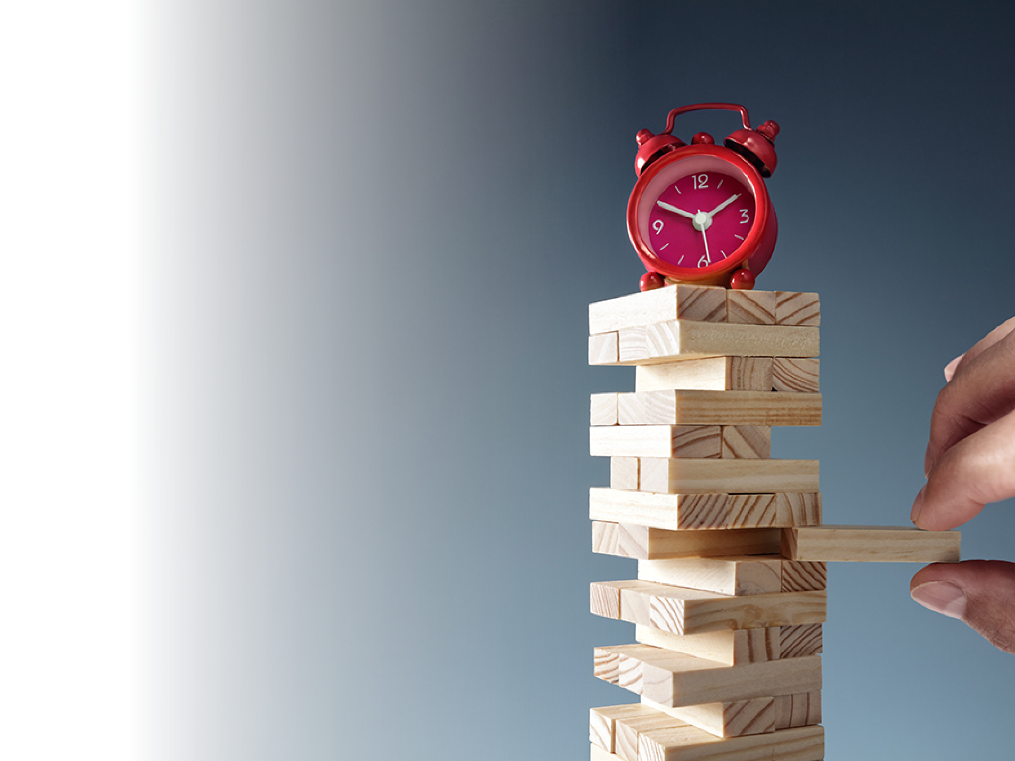 Planning, risk and strategy deadline time in business alarm clock on wooden blocks