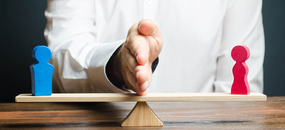 The family lawyer shares the figure of a man and a woman on scales  The concept of divorce and division of property  Solving family disputes  Arbitration Services  Gender pay gap