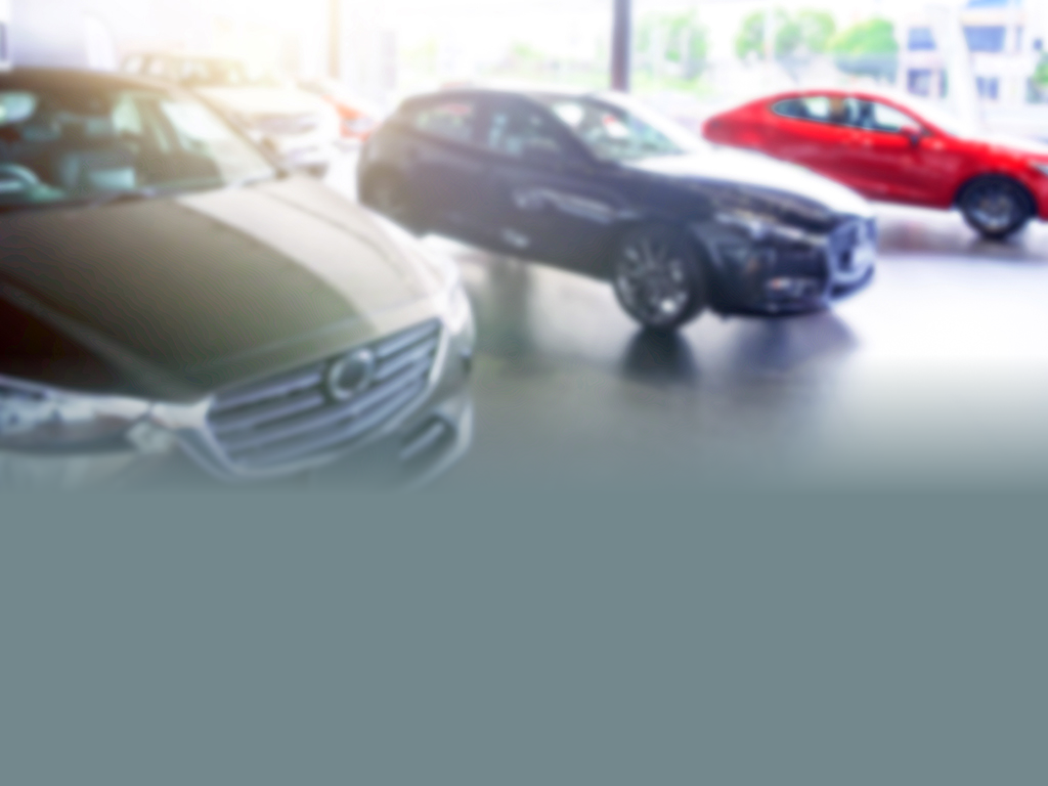 Blurred background of cars for sale in showroom. Automotive car and business transportation concept. Abstract background.