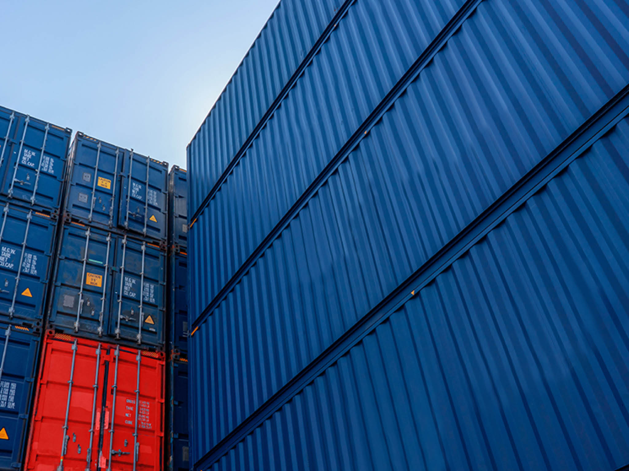 Stack of blue containers box, Cargo freight ship for import export logistics service and transportation